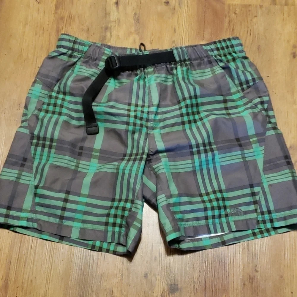 The north face green and gray lined swim trunks